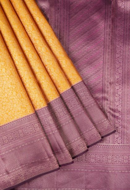 Merigold Orange Kanchipuram Silk Sarees with Copper Zari Floral Patterns