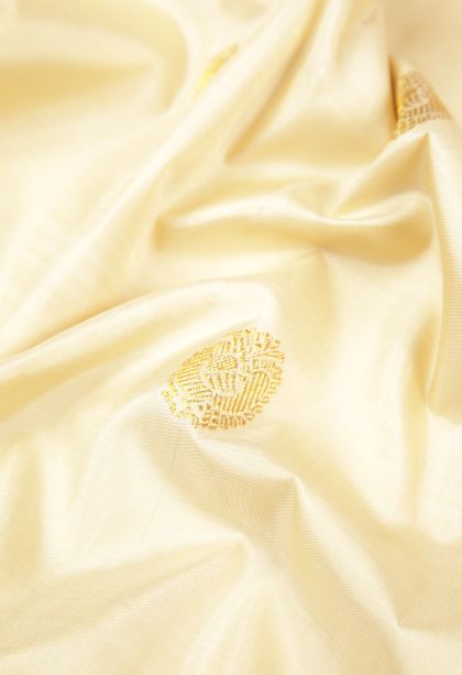 Cream White Kanchipuram Silk Sarees with Gold Zari Buttis (small Dots Or Motifs)