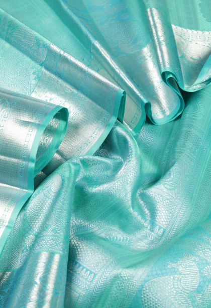 Arctic Blue Kanchipuram Silk Sarees with Silver Zari Floral Patterns