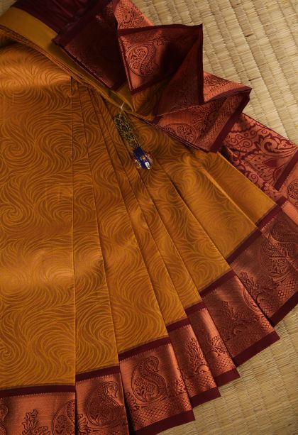 Honey Orange Visiri Madippu Silk Sarees with Copper Zari Floral Patterns