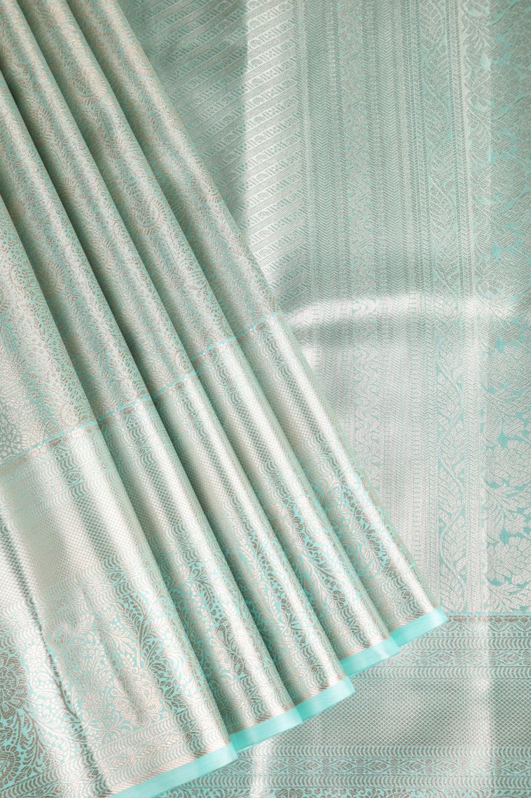 Teal Blue Tissue Silk Sarees with Gold Zari Floral Patterns view 1