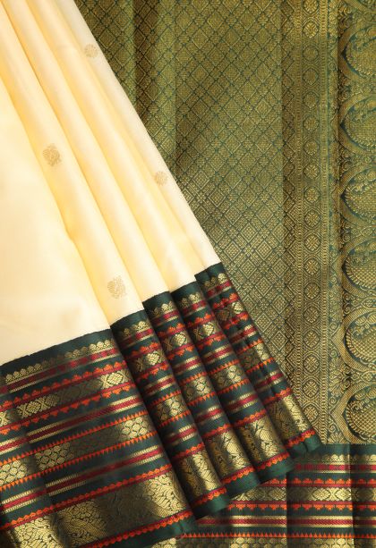 Alabaster White Kanchipuram Silk Sarees with Gold Zari Peacock Motifs