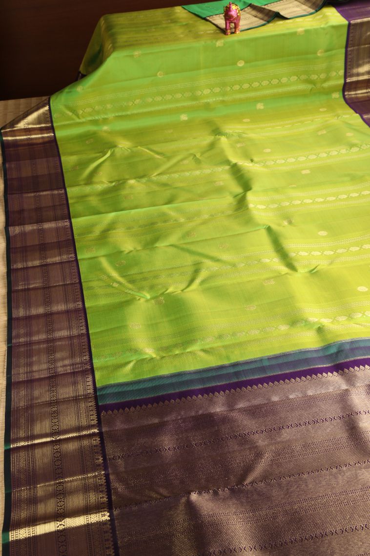 Pear Green Kanchipuram Silk Sarees with Gold Zari Floral Puttas view 2