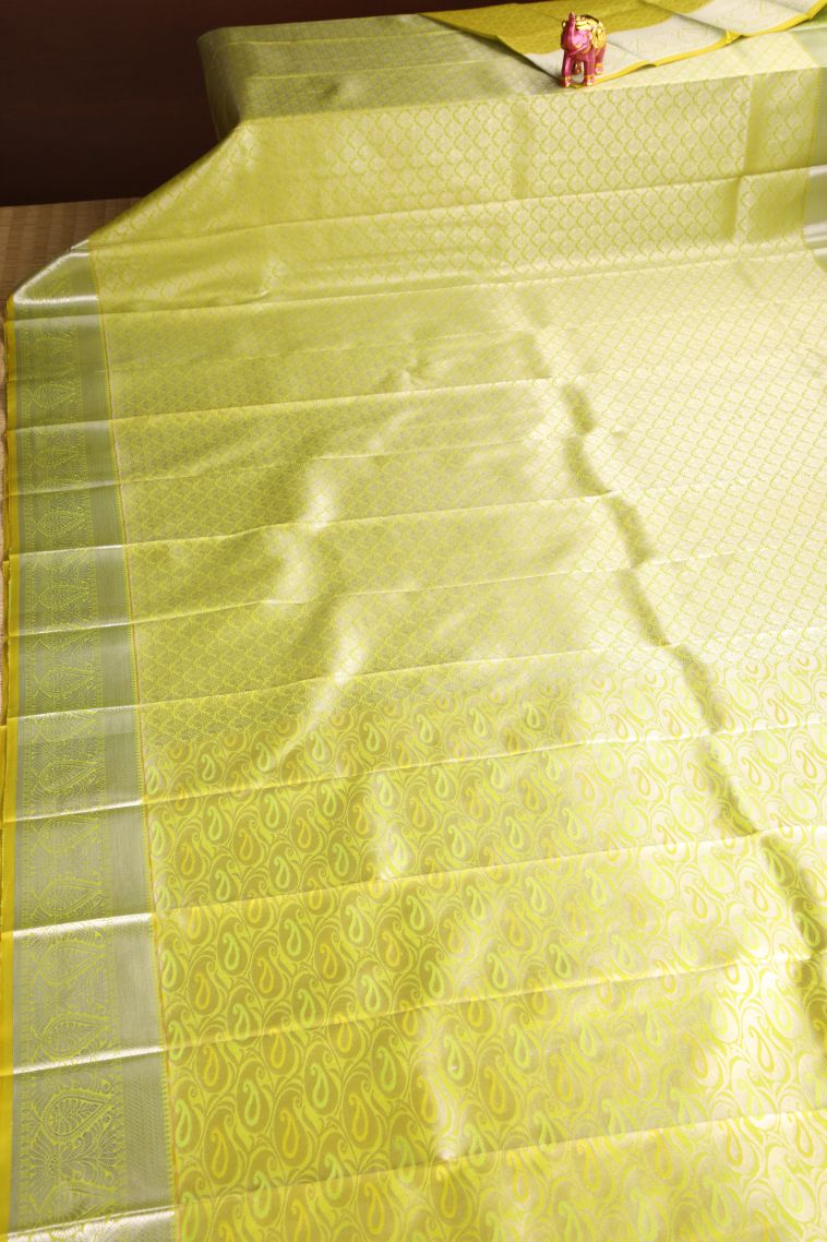 Lime Yellow Visiri Madippu Silk Sarees with Silver Zari Floral Puttas view 2