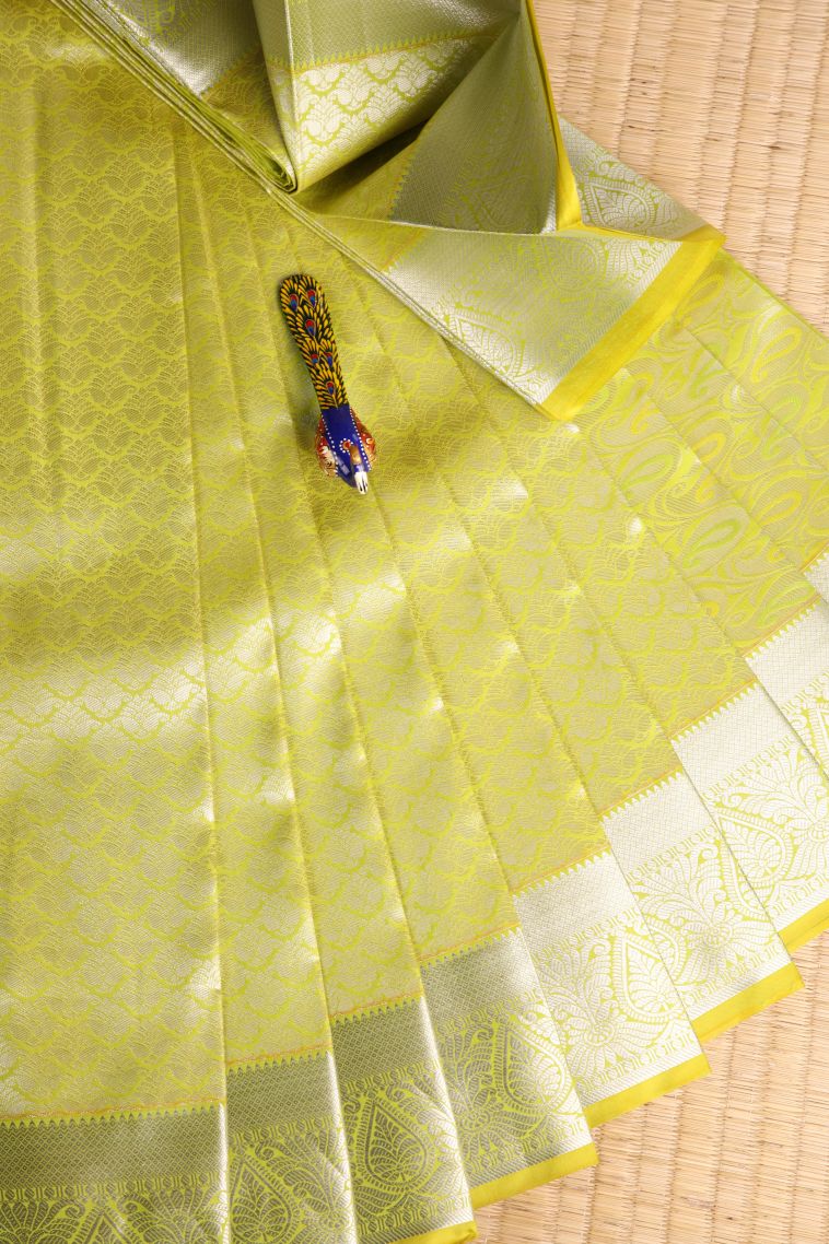 Lime Yellow Visiri Madippu Silk Sarees with Silver Zari Floral Puttas view 1