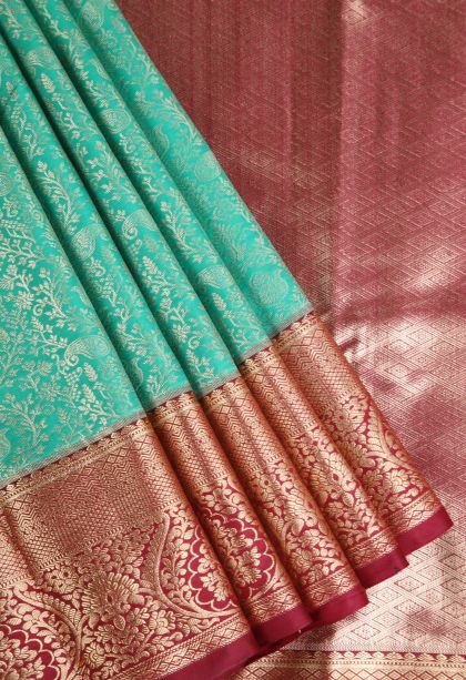 Teal Blue Apoorva Silk Sarees with Copper Zari Floral Patterns