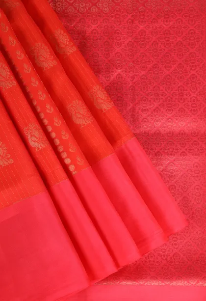 Carrot Orange Soft Silk Saree with Copper Zari Peacock Motifs
