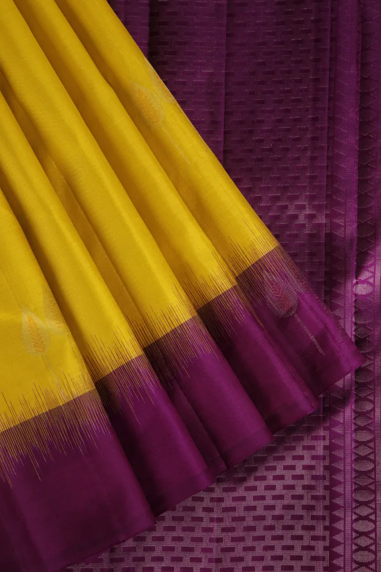 Lemon Yellow Soft Silk Saree with Copper And Silver Zari Leaf Puttas
