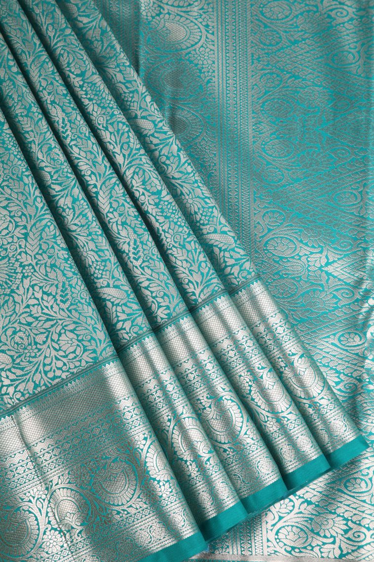 Sapphire Blue Apoorva Silk Sarees with Copper Zari Floral Puttas view 1