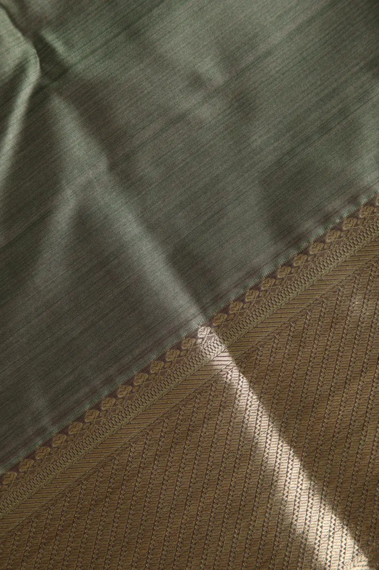Pistachio Green Soft Silk Sarees with Bronze Zari Floral Patterns view 3