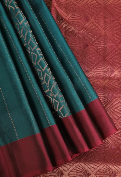 Ocean Blue Soft Silk Saree with Copper Zari Straipes And Puttas