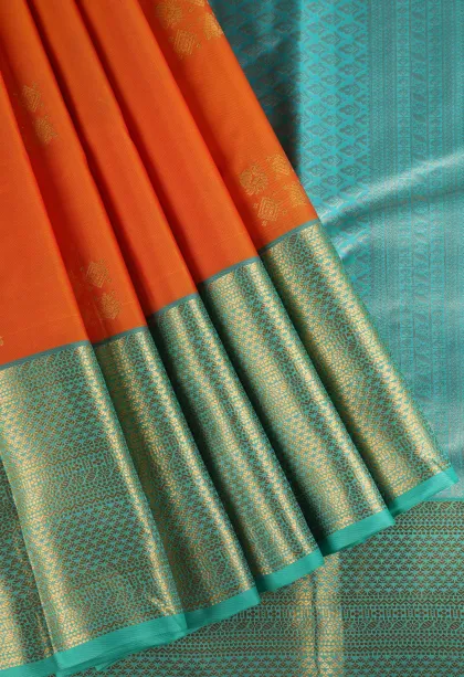 Carrot Orange Soft Silk Saree with Gold Zari Peacock Motifs