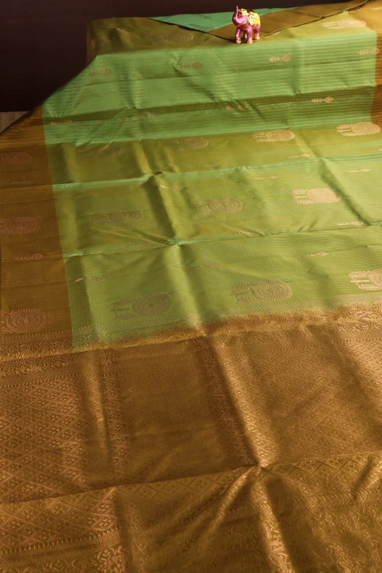 Olive Green Soft Silk Saree with Copper Zari Straipes And Puttas view 2