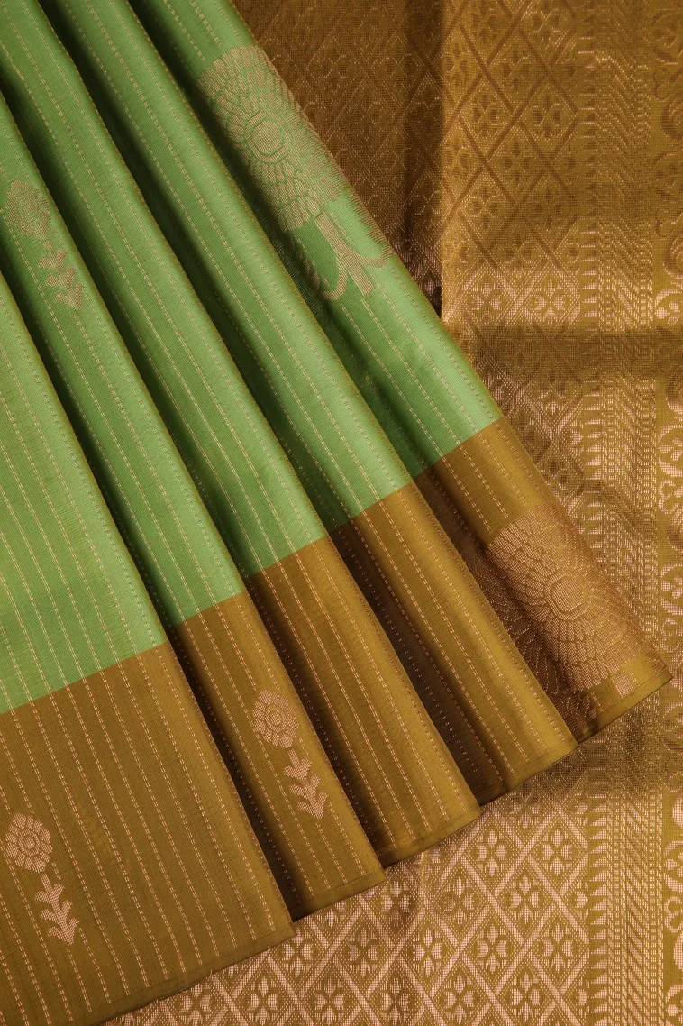 Olive Green Soft Silk Saree with Copper Zari Straipes And Puttas