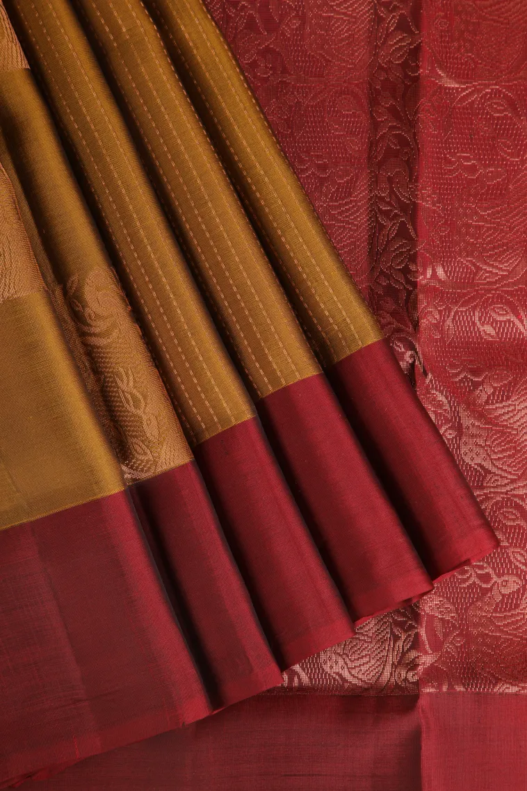 Gold Soft Silk Saree with Copper Zari Straipes And Puttas