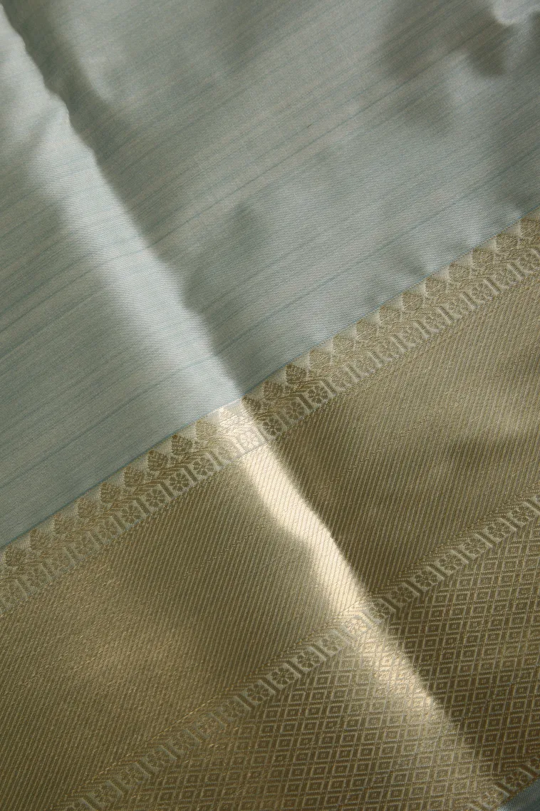 Pistachio Green Soft Silk Sarees with Bronze Zari Floral Patterns view 3