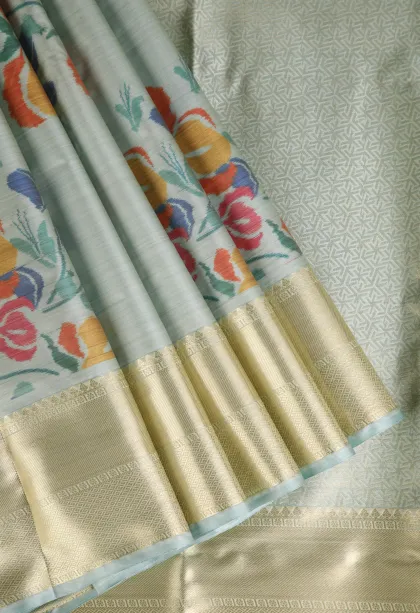 Pistachio Green Soft Silk Sarees with Bronze Zari Floral Patterns