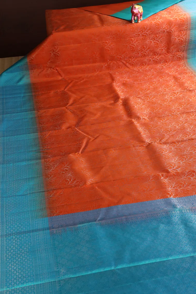 Carrot Orange Soft Silk Saree with Silver Zari Floral Patterns view 2