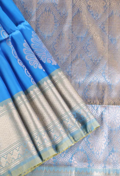 Sky Blue Soft Silk Saree with Gold Zari Stripes And Puttas
