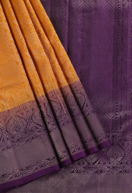 Honey Orange Soft Silk Saree with Silver Zari Floral Puttas